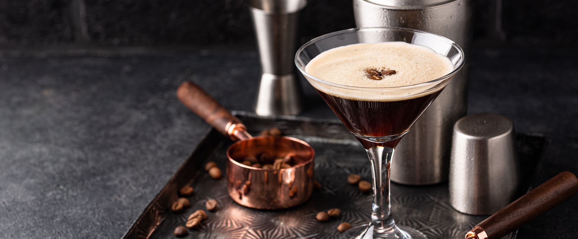 Espresso Martini cocktails with coffee beans and shaker