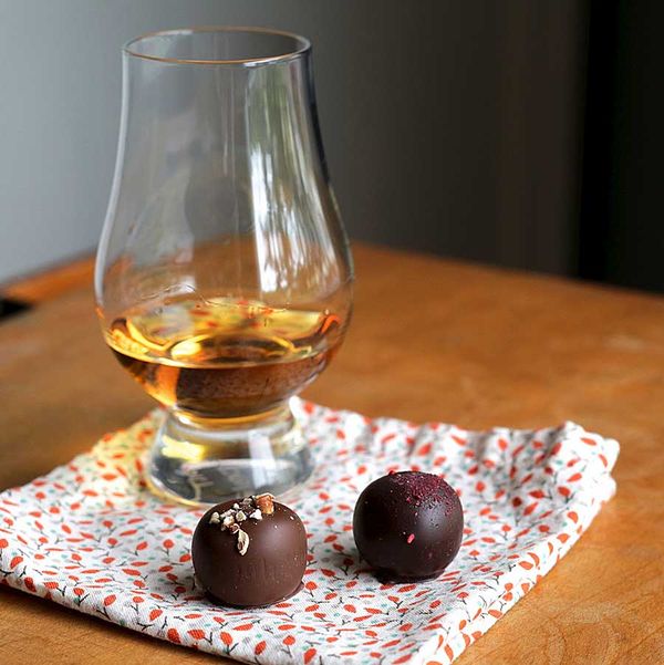 Glass of bourbon and Mash Bill Truffles from Vosges